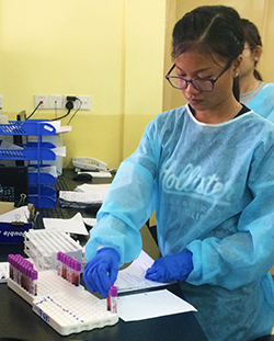 Laboratory staff conducting TASER 2 study tests at the National Center for HIV/AIDS, Dermatology and STD, Phnom Penh, Cambodia, September 2016.