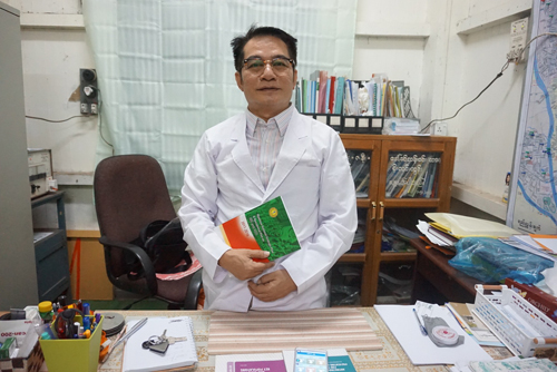 Dr. Myo Thant in his offices.